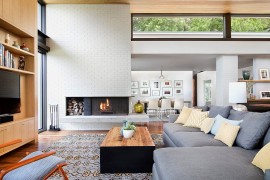 Mid-Century living room remodel with brick walls painted in warm white [Design: Allison Burke Interior Design]