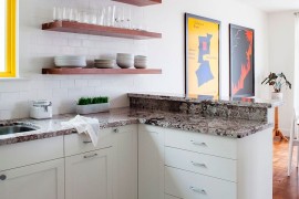 Minimal, open floating wooden shelves are a hit in the contemporary kitchen