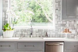 Modern classic kitchen in cool gray features a fabulous tiled backdrop [Design: Modern Nest]