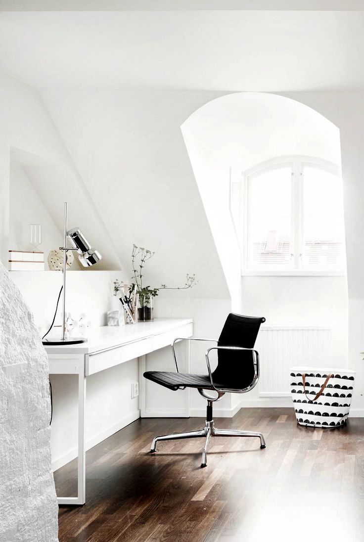 Office area beside a beautiful and bright attic window