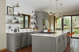 Open shelves coupled with lovely gray cabinets in the transitional kitchen [Design: Fiddlehead Design Group]