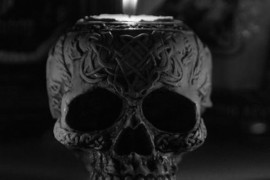 Ornate black skull candle holder