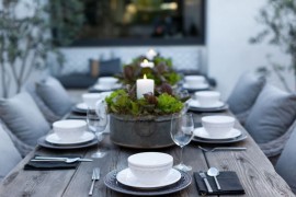 Outdoor dining table with candle centerpieces