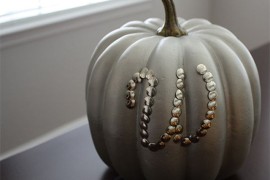 Painted pumpkin decorated with thumbtacks