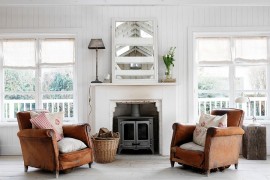 Pair of weathered leather armchairs make all the difference in this living room