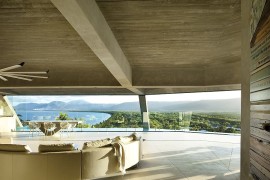 Panaromic views of the distant mountains and ocean from the captivating living area