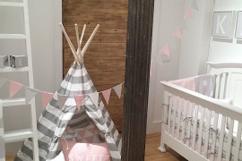 Pink, white, and gray teepee in a little girl's nursery