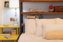 Place a bookshelf behind a bed instead of a headboard