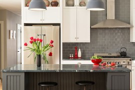 Pops of red brighten the kitchen in multiple shades of gray [Design: George Davis]