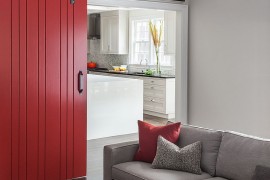 Posh living room in gray with a healthy dose of red