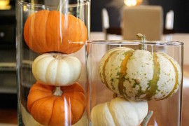 Pumpkins in tall glass cylinders