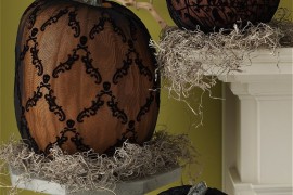 Pumpkins with black lace displayed on platforms
