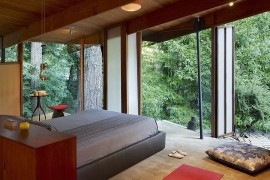 Rustic bedroom with amazing forest views is Zen-conjuring in its own unique way