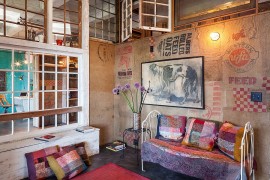 Salvaged burlap feed bags turned into wallpaper for the living room