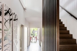 Sleek entry of the Melbourne home with gallery style walls