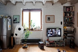 Small industrial living room of Bratislava Apartment with brick walls [Design: Gut Gut]