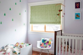 Small nursery design with baby bed and a crib