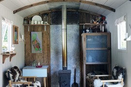 Tiny living room of refurbished railway wagon home