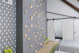 Towering ceiling of the church conversion is perfect for the activity wall in the playroom