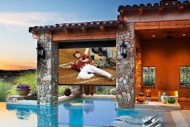 Vinyl screen and projector turn the pool area into a comfy theater