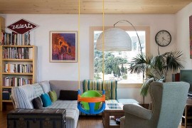 Wooden ceiling and vintage trunk add personality to the interior