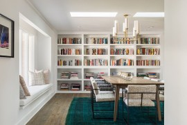A flood of natural light and color scheme give the dining room an airy ambiance