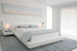 A perfect bedroom for those who love brick walls and loads of white! [Design: Habachy Designs]