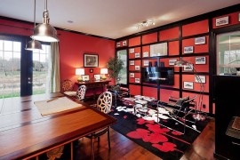 Antique red by Sherwin Williams gives the home office an energetic look