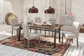 Area rug brings the different elements in the dining space together and defines it