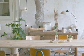 Backdrop and string lighting create the image of a casual, cozy dining room