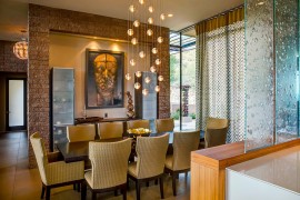 Beautiful Bocci lighting fixture enlivens the modern dining room