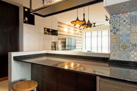 Blue Moroccan tiles add color to the contemporary kitchen