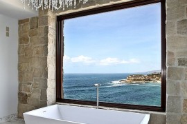 Brilliant antique stone and marble bathroom showcases modern Mediterranean style
