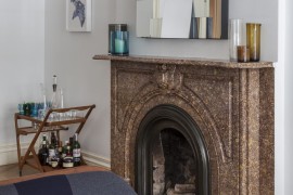 Brown marble fireplace in an eclectic space
