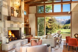 Captivating use of Colorado sandstone and split brownstone for the fireplace wall