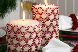 Christmas candies glued to white pillar candles