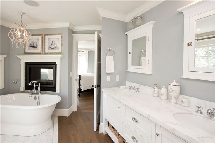 Clean and tranquil bathroom with dual fireplace