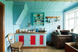 Clever use of blue in the kitchen gives it a cheerful and visually spacious look [From: Michael Kelley Photography]