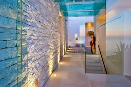 Contemporary entry of stylish home with in-floor lighting