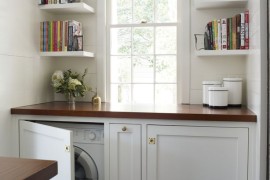 Custom cabinets with countertop to hide washer and dryer