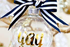 DIY personalized glass ornaments in gold with black and white ribbon