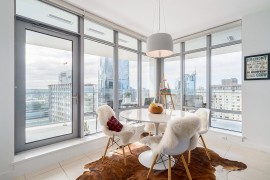 Dining area with classic Saarinen table and smart city view