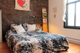 Eclectic bedroom with exposed brick wall and Scandinavian vibe