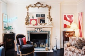 Eclectic living room with a traditional marble fireplace