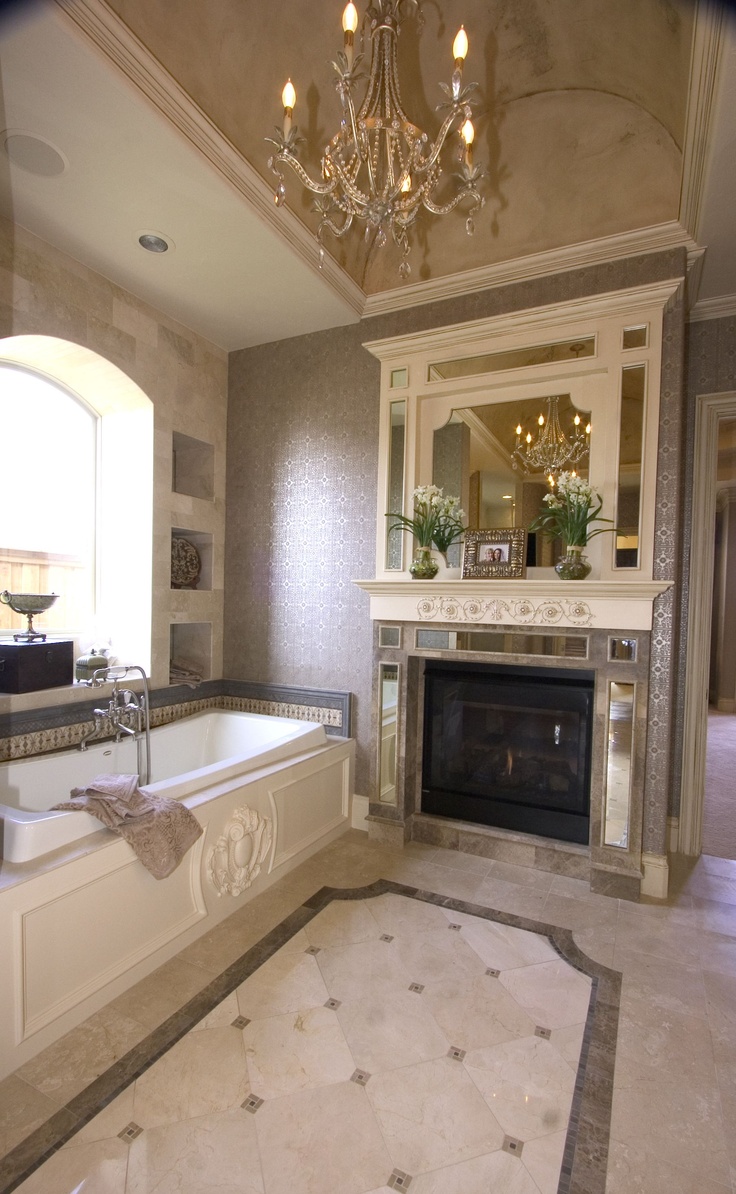 Elegant fireplace next to tub