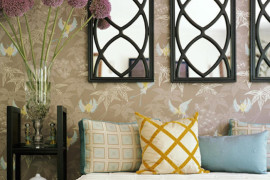 Entryway with three decorative mirrors