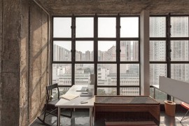 Expansive windows bring a flood of natural light into the home office