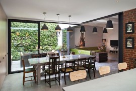 Exposed brick walls in the kitchen reflect the past of revamped home