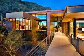 Fabulous entry bridge also acts as a lovely walkway surrounded by the arid landscape
