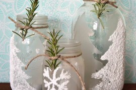 Frosted winter-themed mason jar candle holders with epsom salts